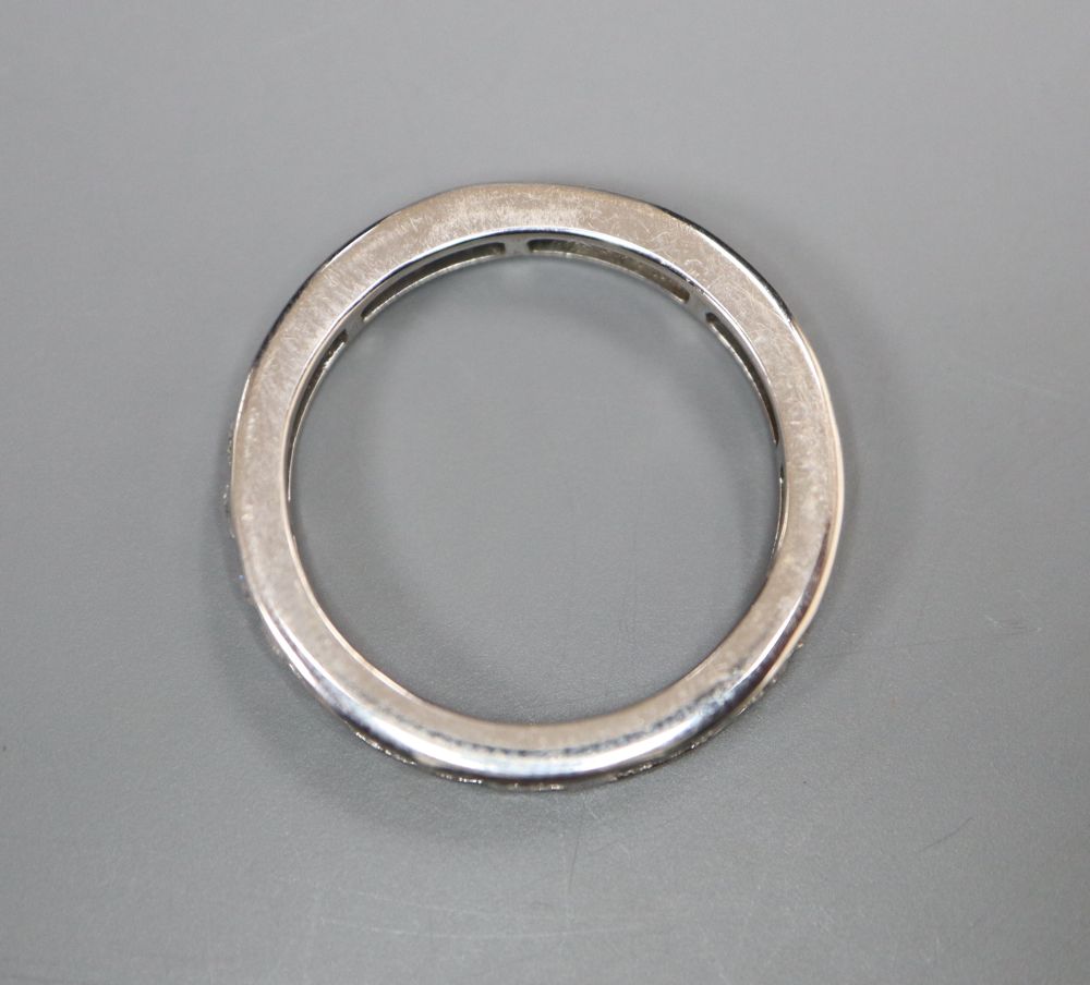 A modern 18ct white gold and diamond set full eternity ring, size M gross 2.6 grams.